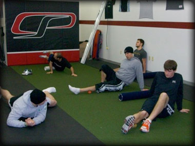 A group of Cressey's athletes do their soft-tissue work.