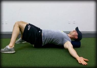 Lying knee-to-knee stretch to correct capsular restrictions